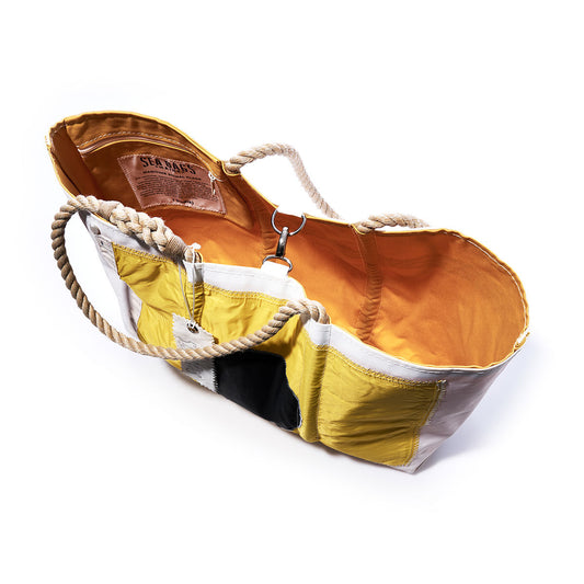 Sea Bags India Signal Flag Large Tote featuring rope handles, a patchwork yellow and white exterior crafted from recycled sail cloth inspired by vintage signal flags, an orange interior lining, and an interior label reading “SEA BAGS.”. by Sea Bags