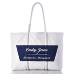 Sea Bags Custom Boat Name Tote in white, designed with rope handles and finished with a navy blue patch featuring an anchor and the text “Lady Jane Annapolis, Maryland” at the center. by Sea Bags