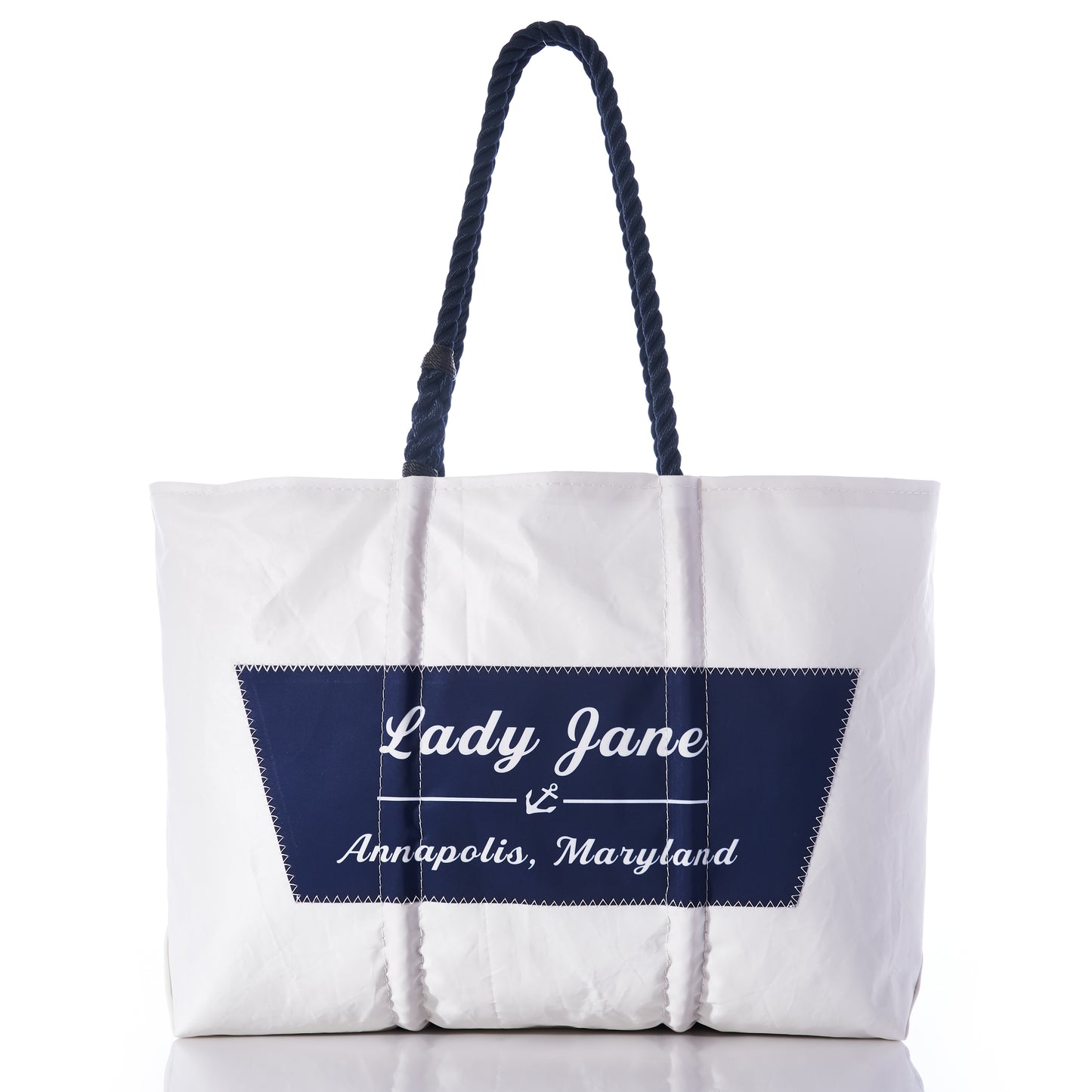 Sea Bags Custom Boat Name Tote featuring navy rope handles and a navy patch with Lady Jane, Annapolis, Maryland on the front, photographed against a white background. This stylish personalized tote is perfect for carrying your essentials. by Sea Bags