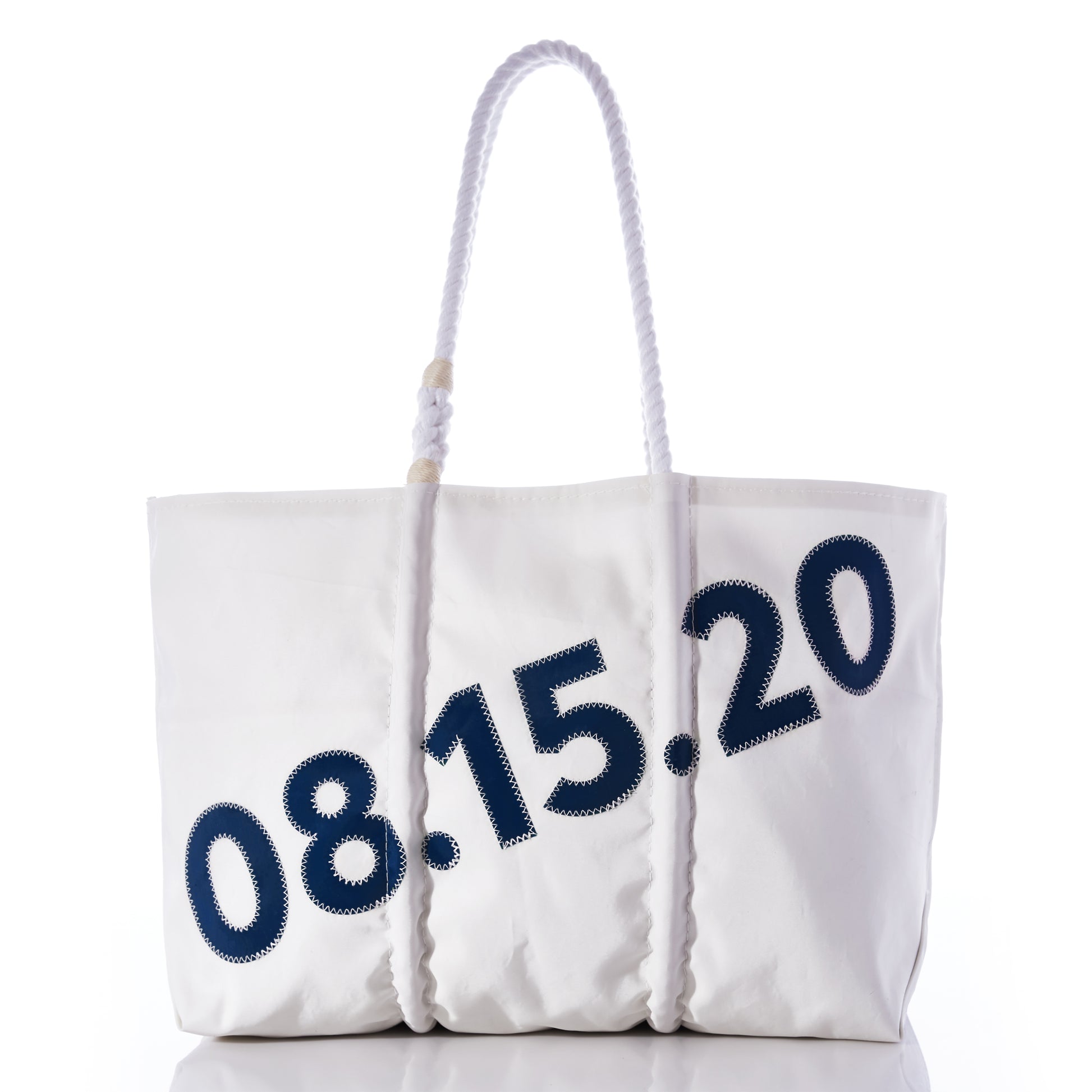Introducing the Custom Date Tote from Sea Bags—a white tote bag with sturdy rope handles, showcasing the date 08.15.20 in bold blue numbers across the front. This personalized tote also comes with a custom message patch, making it a unique and meaningful keepsake for any special occasion. by Sea Bags