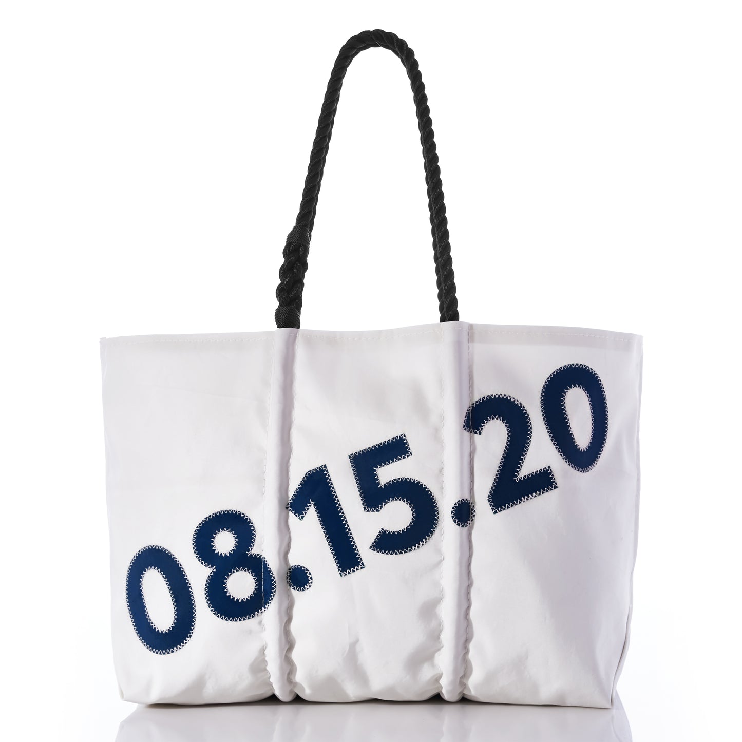 The Sea Bags Custom Date Tote features thick black rope handles and bold navy text 08.15.20 displayed diagonally across the front, emphasizing its personalized design; the white tote is showcased on a plain white surface with a minimalist background. by Sea Bags
