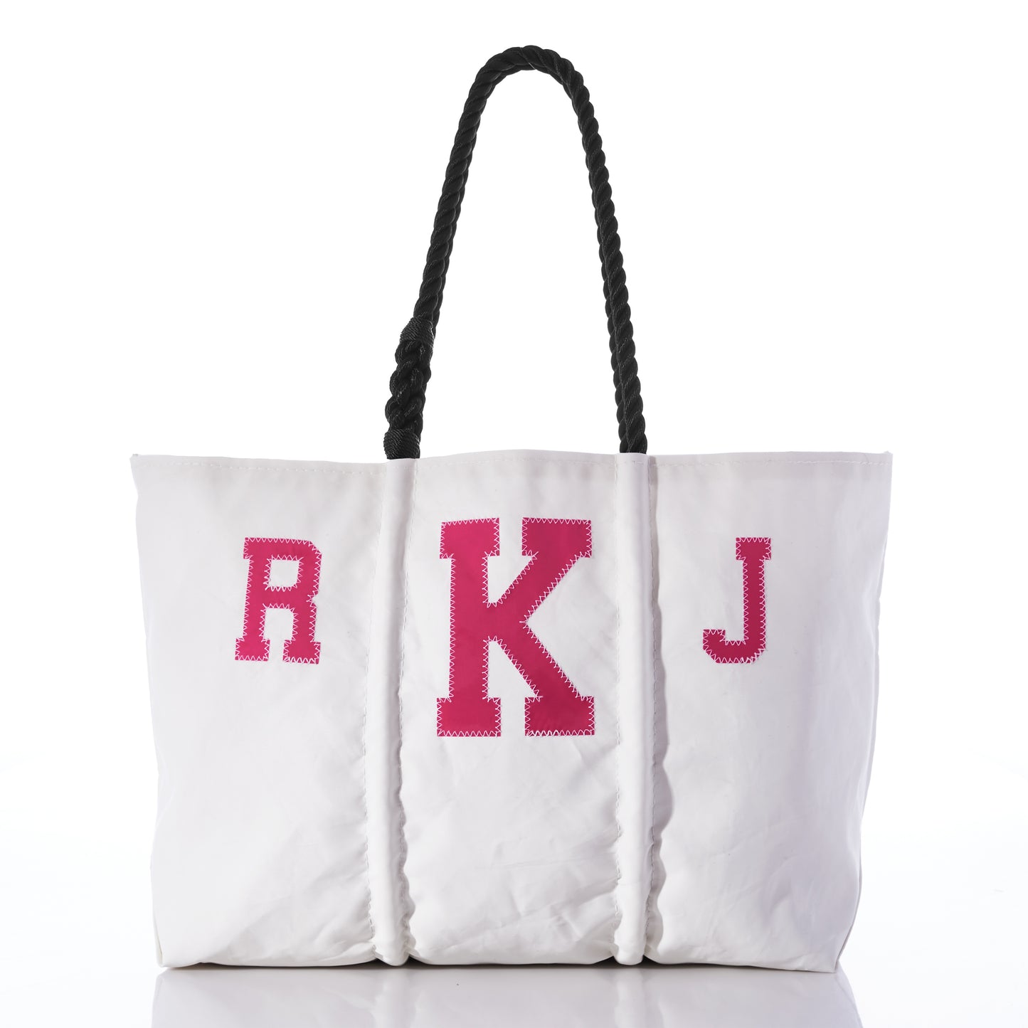 Introducing the Custom Monogram Tote by Sea Bags—a white tote bag made from recycled sail cloth, featuring black rope handles and a bold pink R K J monogram on the front. Photographed against a white background, this stylish accessory is perfect for personalization. by Sea Bags