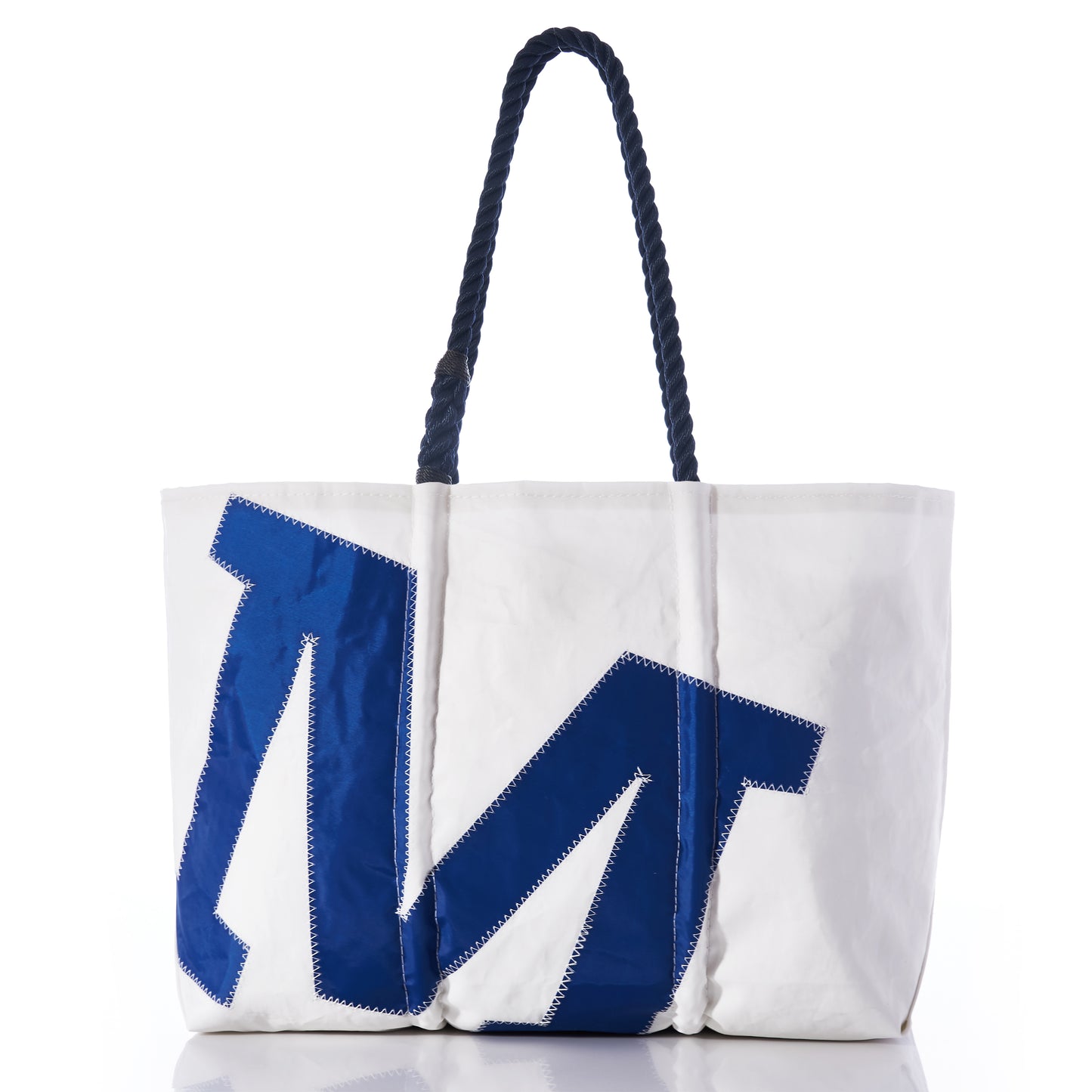 Sea Bags Custom Single Letter Large Tote crafted from white recycled sailcloth, featuring thick navy rope handles and a bold blue appliqué letter M on the front. by Sea Bags