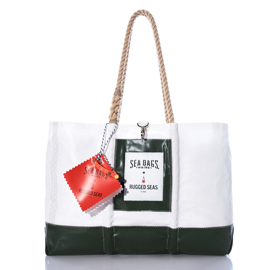 Introducing the Trapline Large Tote - Dark Green by Sea Bags: a spacious white and dark green tote crafted from recycled sail cloth, featuring sturdy rope handles, a front pocket with SEA BAGS x RUGGED SEAS branding, and a red tag accent—thoughtfully designed to honor the legacy of Maine lobster fishermen while bringing ocean-inspired style to your everyday adventures. by Sea Bags