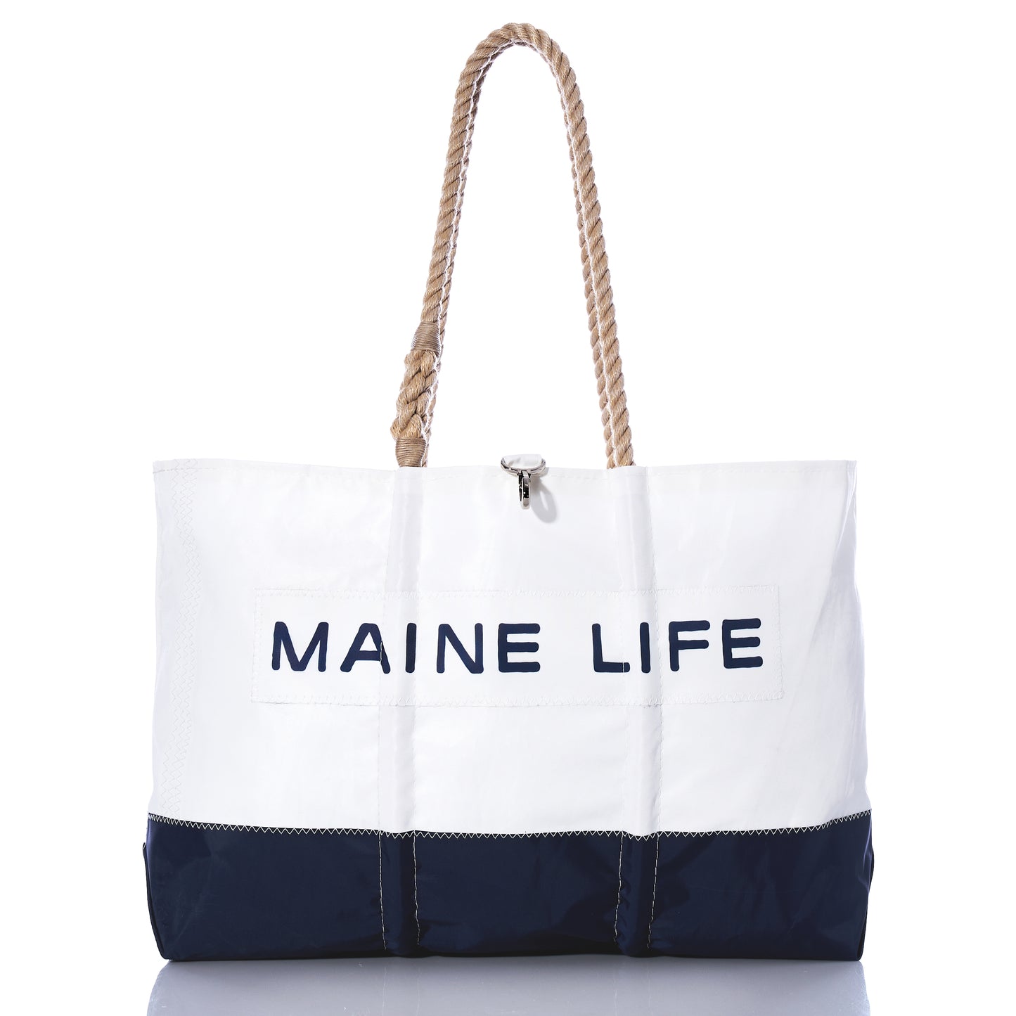 The Sea Bags Maine Life Large Tote is a spacious white and navy bag featuring sturdy rope handles and MAINE LIFE printed on the front, photographed against a white background. Inspired by Erin Ovalle’s signature Maine Life collection, this tote is perfect for everyday adventures. by Sea Bags
