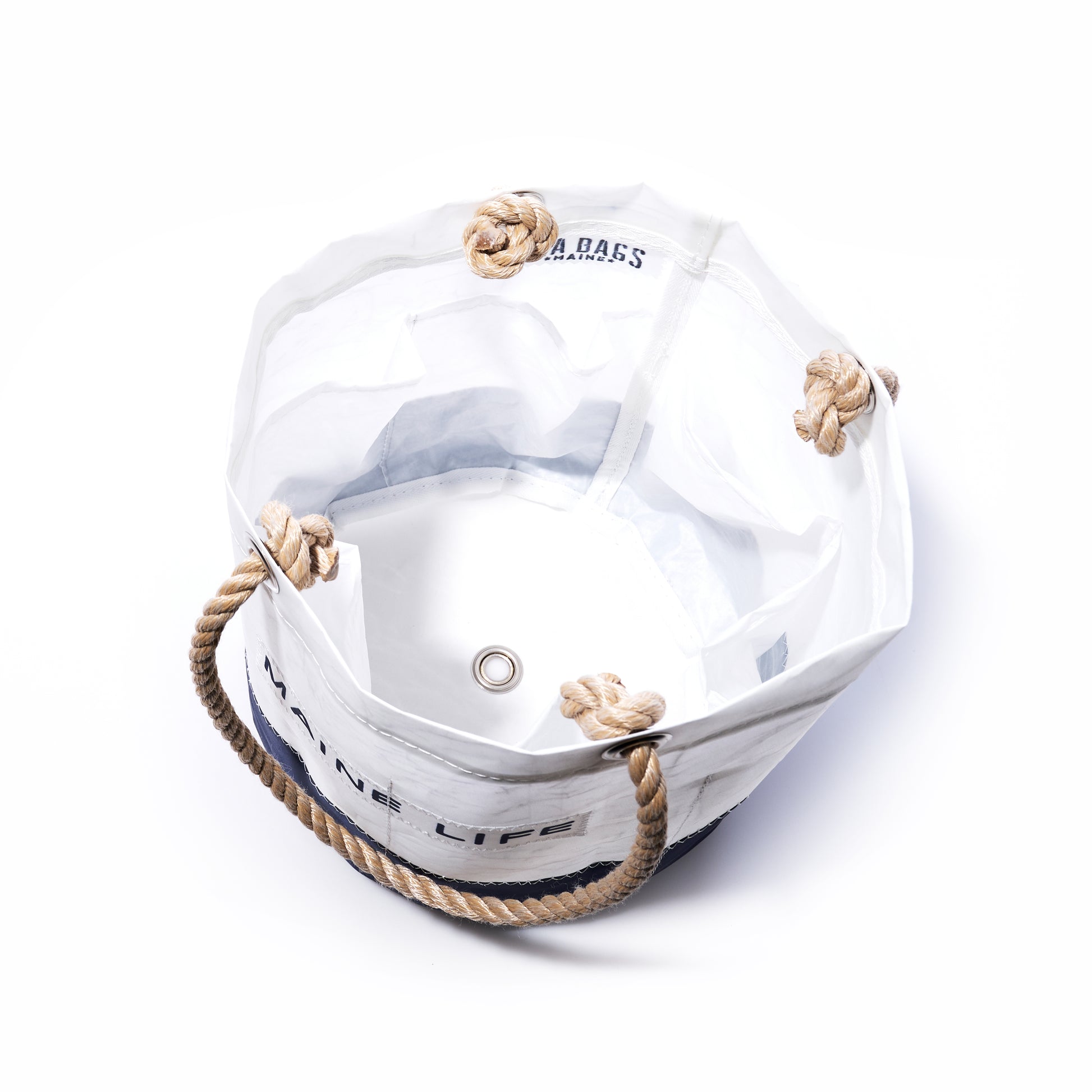 Sea Bags Maine Life Beverage Bucket—crafted from recycled sail cloth for authentic Maine Life style, this white round canvas bag features rope handles, a nautical-themed design, and a metal grommet at the base. The bucket is empty and photographed on a white background. by Sea Bags