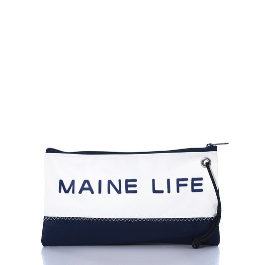 The Maine Life Large Wristlet by Sea Bags is a rectangular pouch with a wrist strap, featuring a zippered closure. It has a white top and navy bottom, and showcases MAINE LIFE—named after the popular TV show—in bold navy letters. by Sea Bags