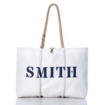 Custom Family Gift Tote - White by Sea Bags, crafted from sustainable recycled sail cloth and displayed against a white background, features thick rope handles and bold black SMITH lettering. by Sea Bags