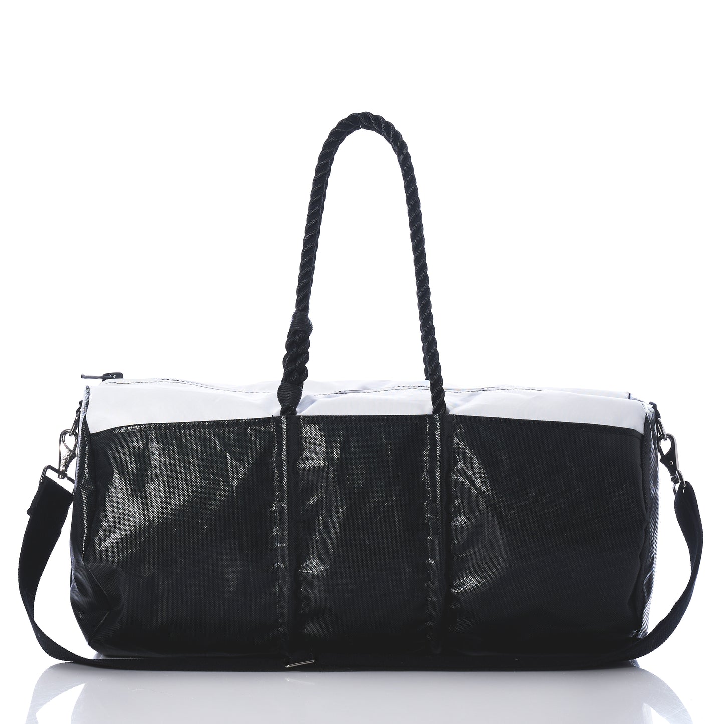 Introducing the Black Dragon Duffel by Sea Bags—a black and white travel duffel bag made from recycled sail cloth, designed with rope handles and a detachable shoulder strap. Shown on a reflective surface against a white background, this water-resistant bag combines style and durability, making it the perfect companion for your next adventure. by Sea Bags