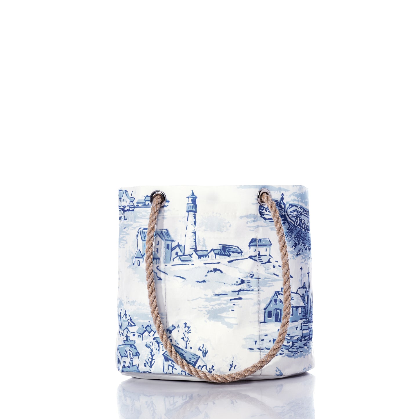 The Sea Bags Maine Fishing Village Essential Handbag is a white and blue canvas nautical bag, crafted from recycled sail cloth and adorned with charming illustrations of a lighthouse and coastal Maine scenery, featuring sturdy rope handles—all presented on a white background. by Sea Bags