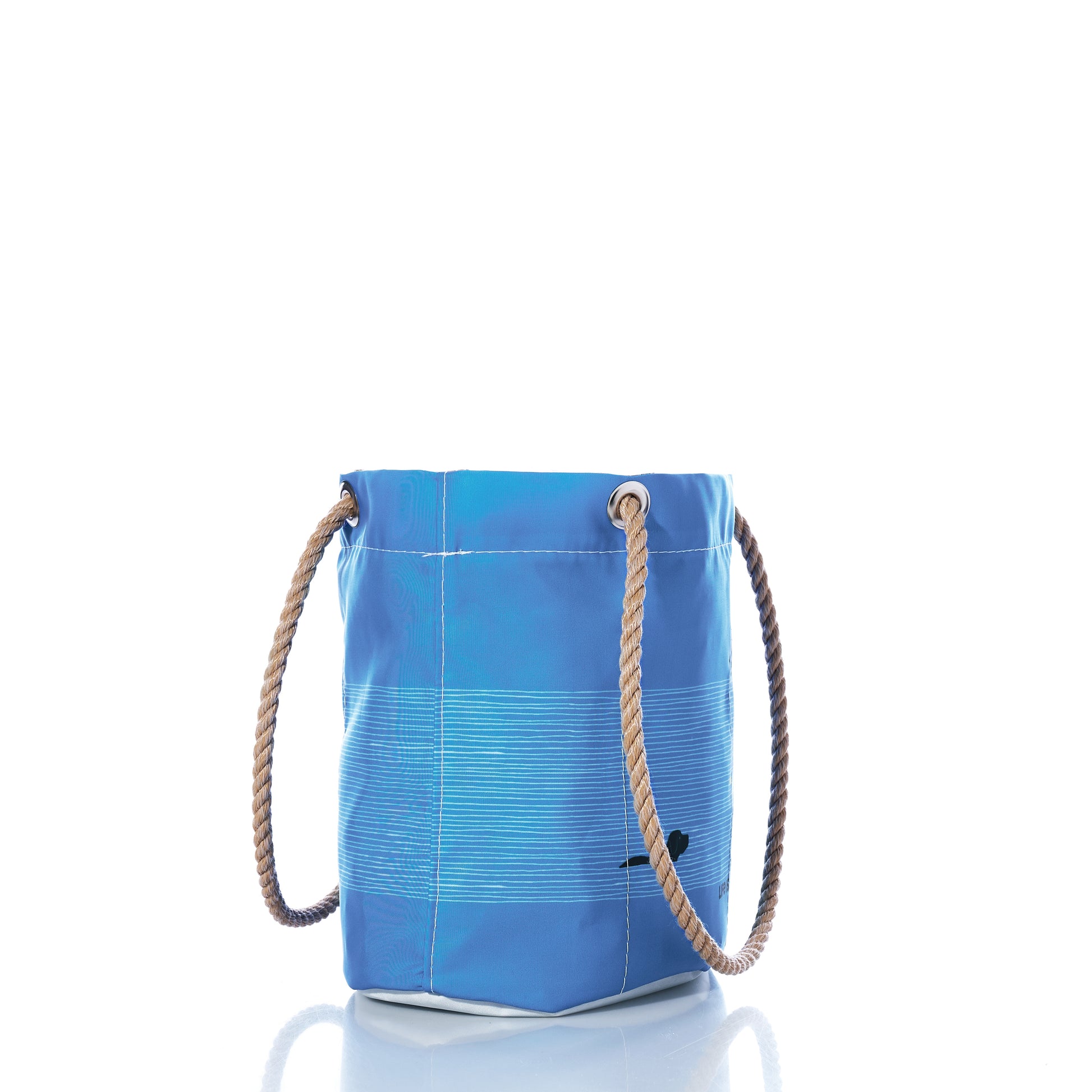 The Sea Bags Life is Good Dog Days Essential Handbag features a blue cylindrical design with rope handles and metal grommets, crafted from recycled sailcloth for sustainability and pictured upright on a white background. by Sea Bags