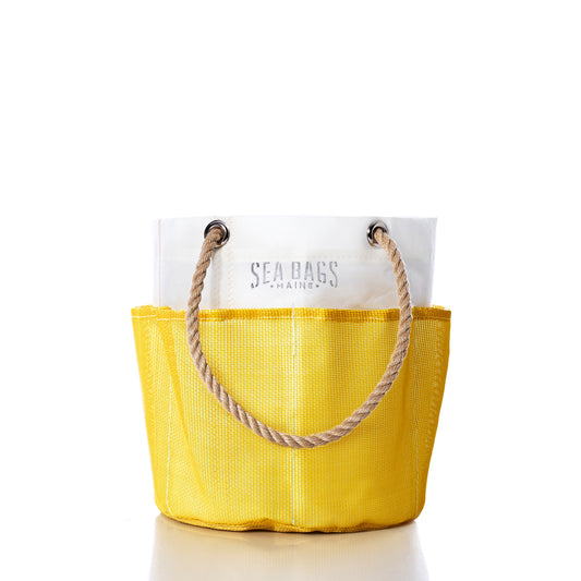 The Goldenrod Gardeners Bucket Bag by Sea Bags features yellow and white panels with sturdy rope handles and “SEA BAGS MAINE” printed on the white section, photographed against a white background—perfect for carrying your gardening essentials or using as a stylish gardeners bucket. by Sea Bags