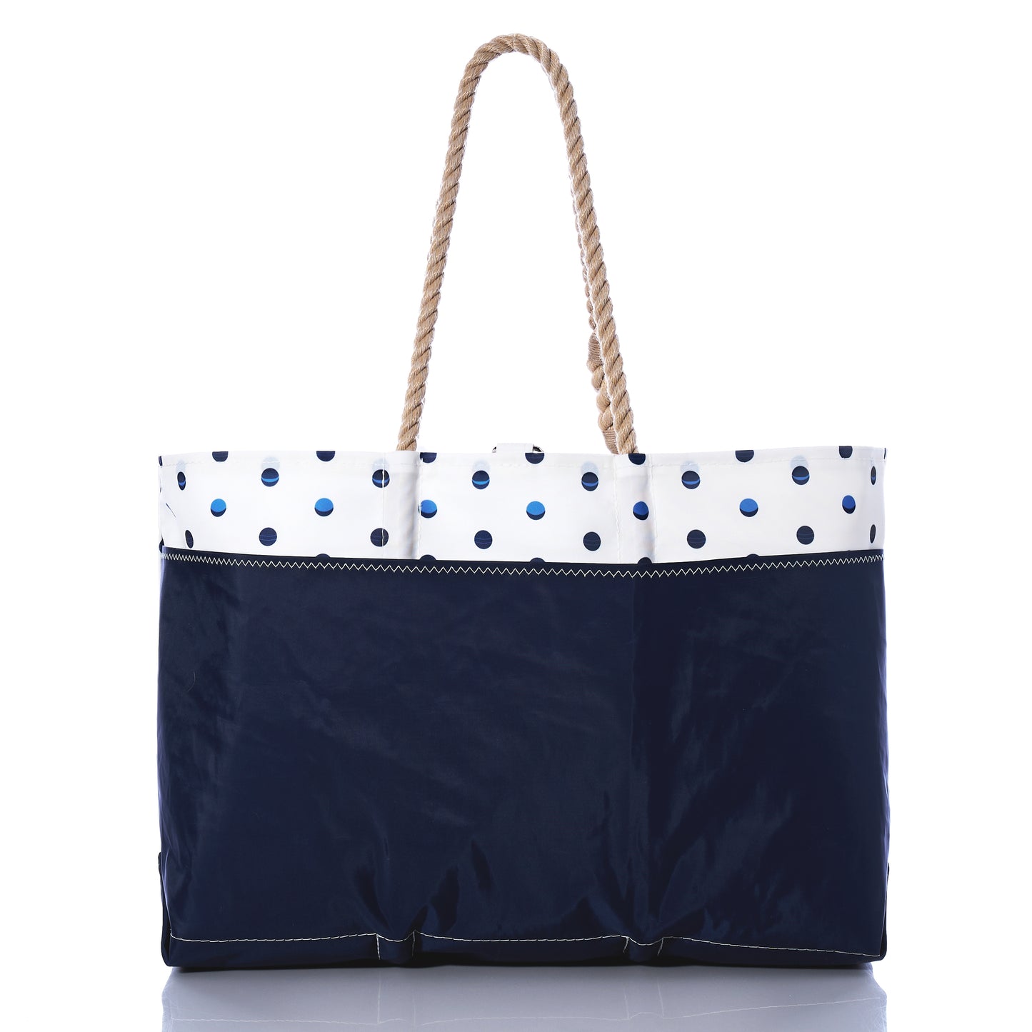 Sea Bags Fuchsia Anchor  Summer Dots Ogunquit Beach Tote, made from recycled sail cloth, features a navy bottom, a white upper section decorated with blue polka dots and a bright fuchsia anchor, and is finished with two twisted rope handles; shown on a white background. by Sea Bags