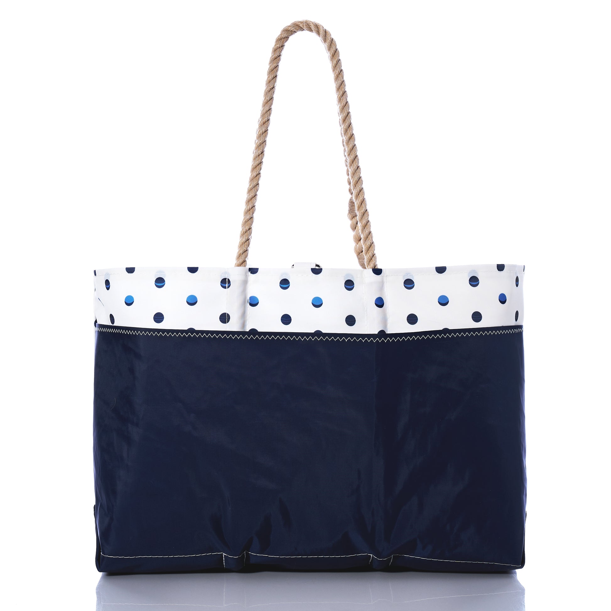 Sea Bags Fuchsia Anchor  Summer Dots Ogunquit Beach Tote, made from recycled sail cloth, features a navy bottom, a white upper section decorated with blue polka dots and a bright fuchsia anchor, and is finished with two twisted rope handles; shown on a white background. by Sea Bags