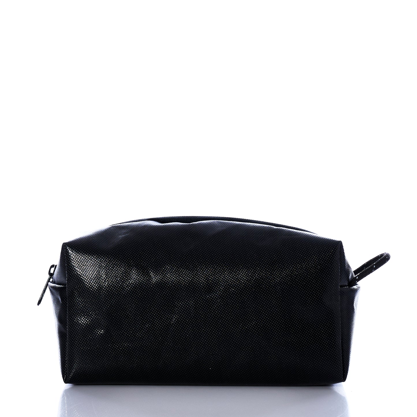 The Sea Bags Black Dragon Toiletry Bag is a rectangular, water-resistant toiletry kit featuring a textured black surface, a zippered closure, and a small side handle, shown here against a white background. by Sea Bags