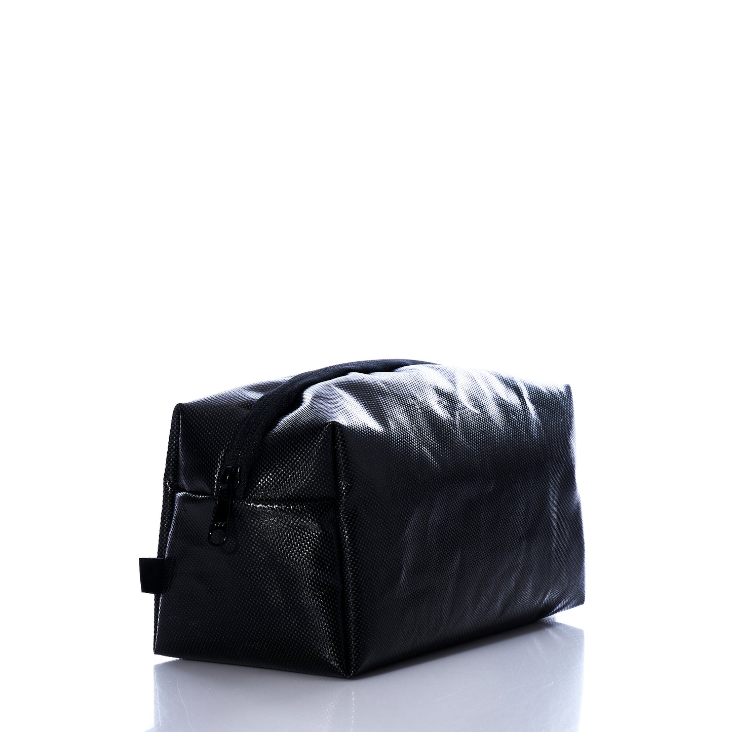 The Sea Bags Black Dragon Toiletry Bag, a rectangular zippered kit, is showcased against a white backdrop at a slight angle. Both stylish and practical, this water-resistant bag makes an exceptional gift for travelers or anyone who values organized essentials. by Sea Bags