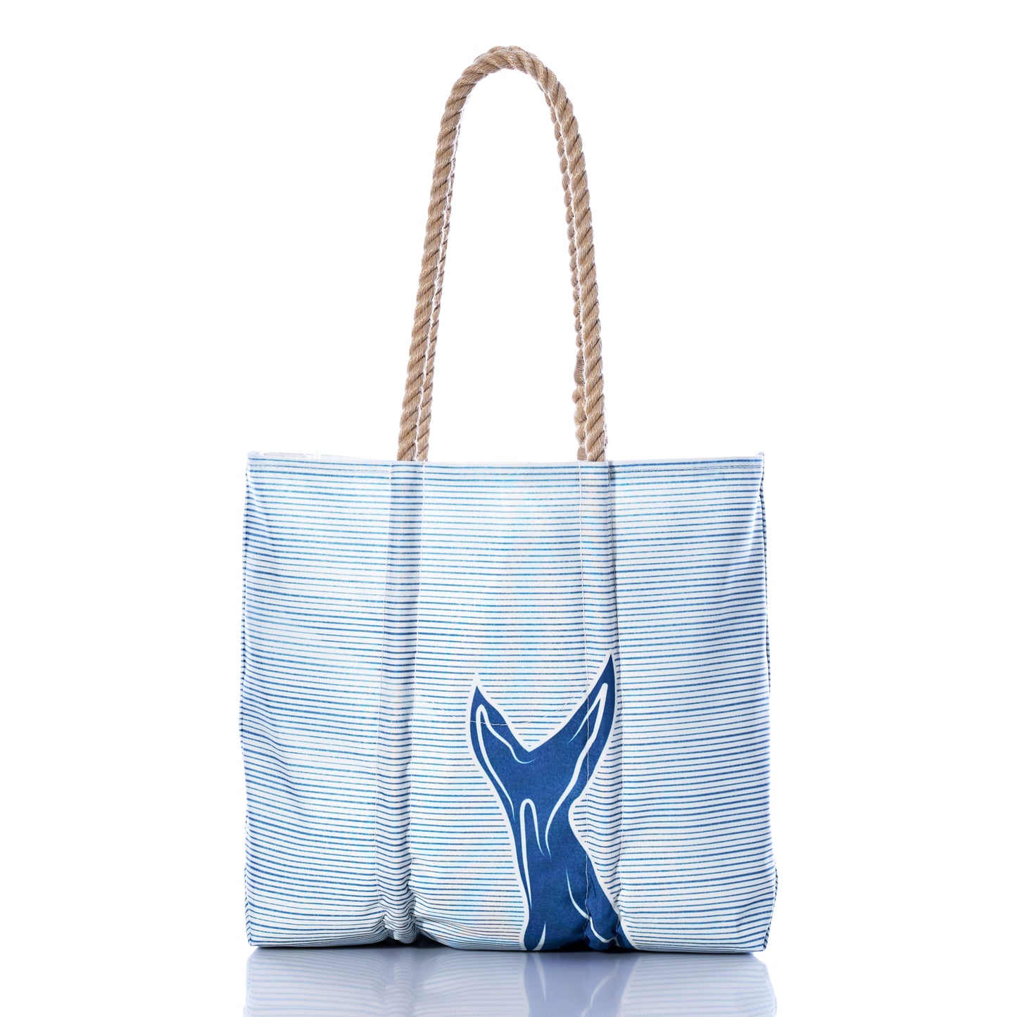 Sea Bags Whale Watch Medium Tote, handcrafted in Maine from recycled sailcloth, features blue and white stripes with a navy blue whale tail design on the front and rope handles, shown on a white background. by Sea Bags