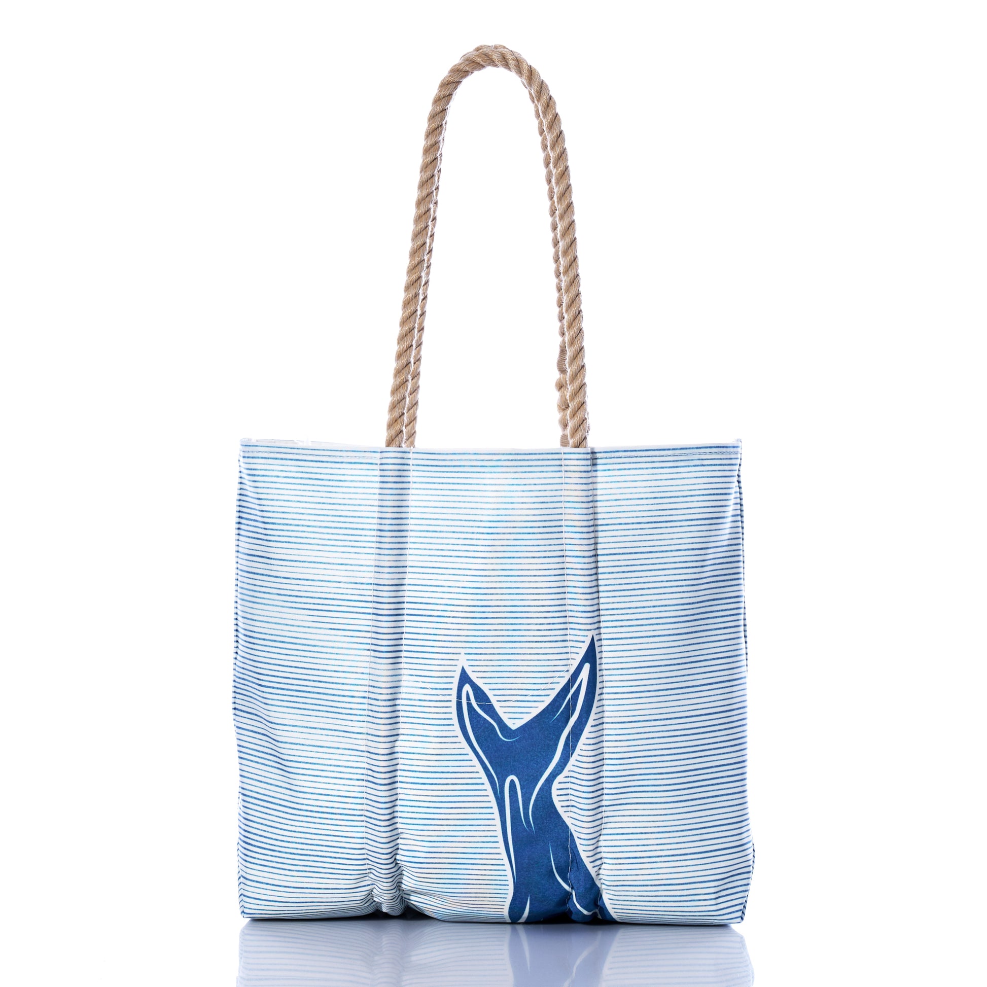 Sea Bags Whale Watch Medium Tote, handcrafted in Maine from recycled sailcloth, features blue and white stripes with a navy blue whale tail design on the front and rope handles, shown on a white background. by Sea Bags