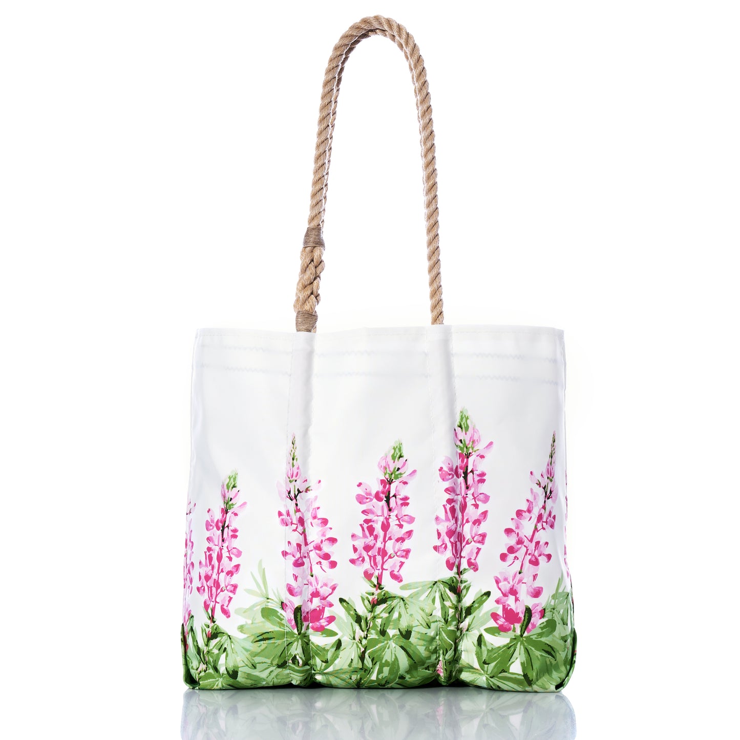 Sea Bags Pink Lupine Medium Tote is a sustainable everyday bag crafted from recycled sails, featuring rope handles and a pink floral print with green leaves near the base, inspired by the charm of a Maine wildflower bag. Displayed on a white background. by Sea Bags