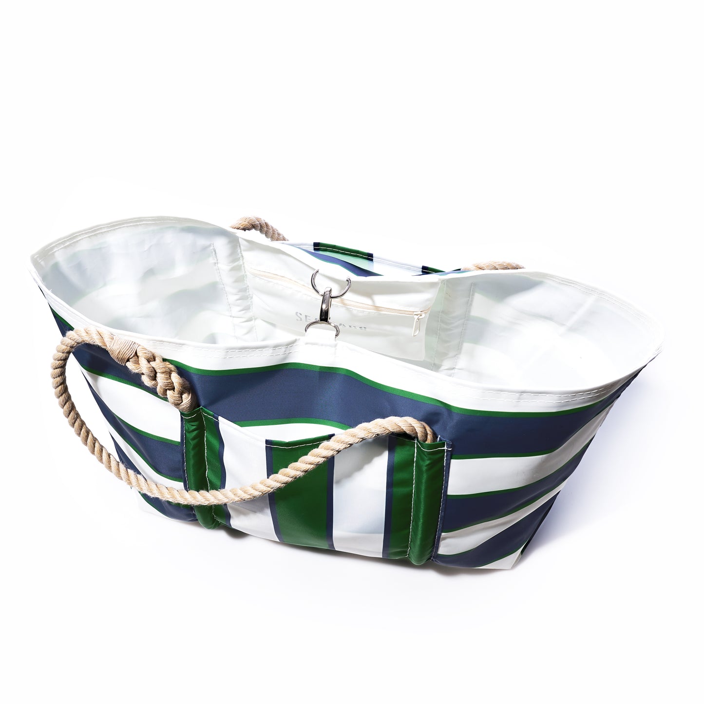 The Sea Bags Preppy Stripe Pier Tote is a spacious bag made from recycled sail cloth, accented with signature New England rope handles, a white interior lining, and an inner zippered pocket. by Sea Bags