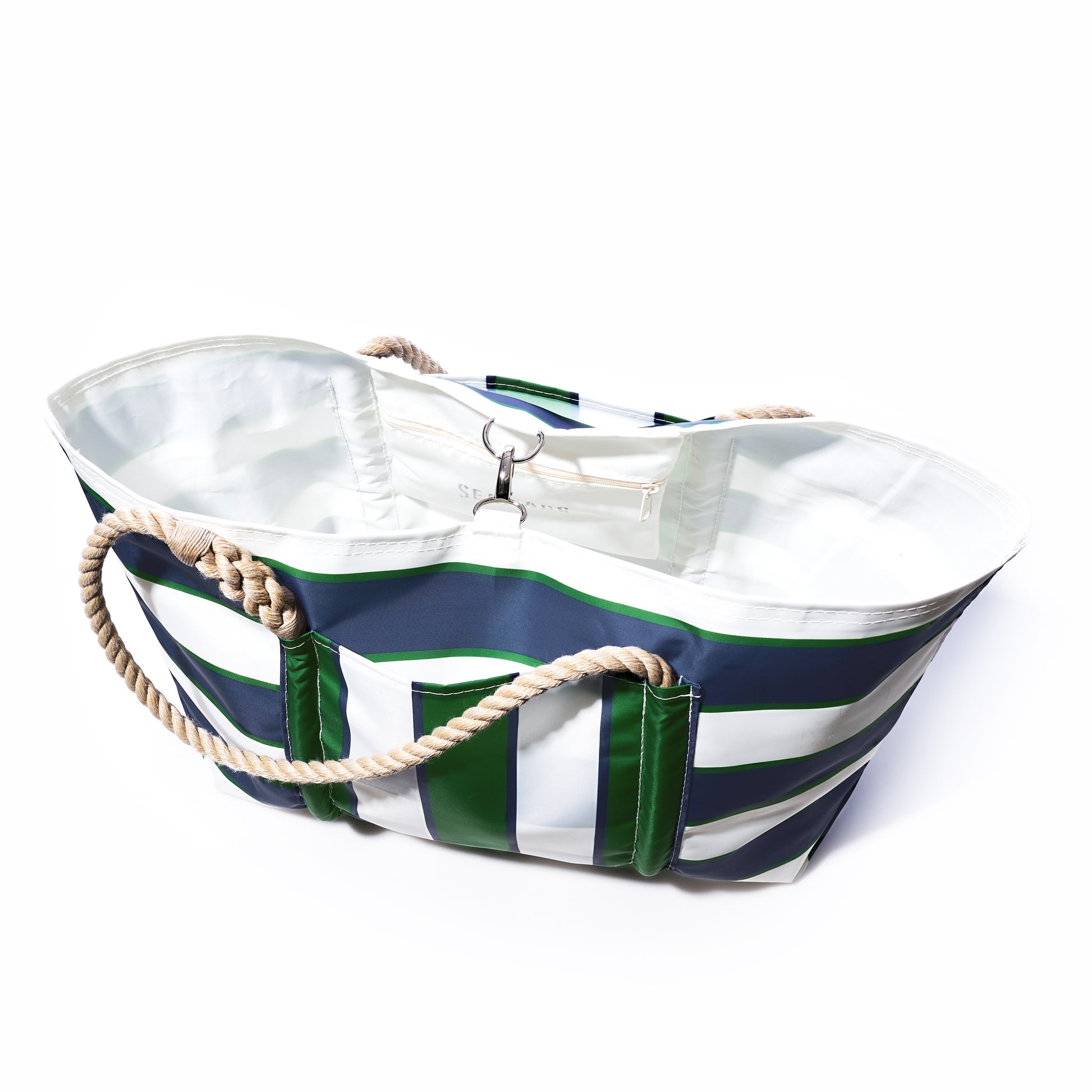 The Sea Bags Preppy Stripe Pier Tote is a spacious bag made from recycled sail cloth, accented with signature New England rope handles, a white interior lining, and an inner zippered pocket. by Sea Bags