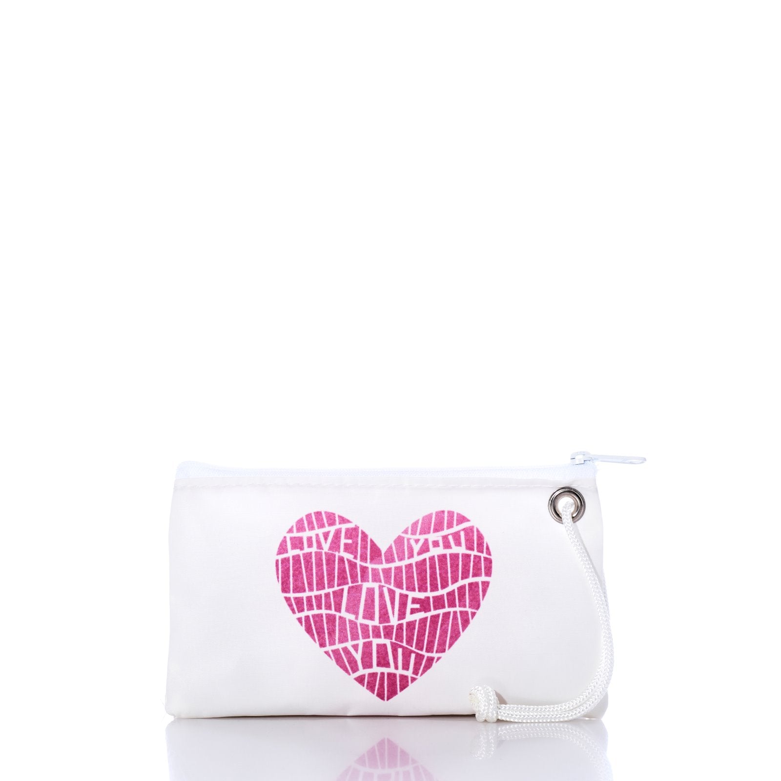 The Sea Bags Love Notes Wristlet is a small white zippered pouch with a pink mosaic heart graphic filled with the repeated words LOVE YOU, and features a white wrist strap on the right side—making it a charming Valentine’s Day gift. by Sea Bags