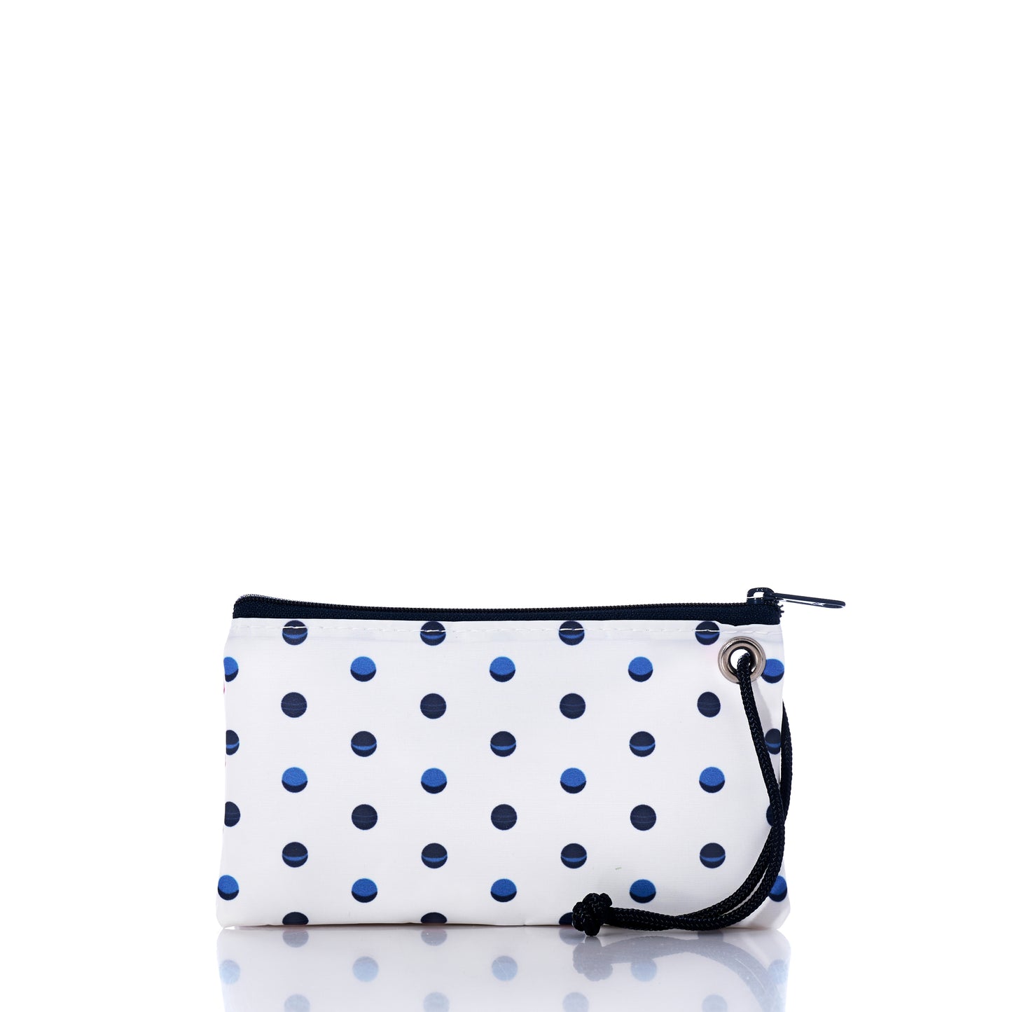 The Flip Side Summer Dots Wristlet by Sea Bags is a white zippered pouch adorned with a black and blue polka dot pattern, expertly crafted from reclaimed sailcloth. Featuring a convenient black drawstring loop on the right side, this stylish accessory is perfect for travel, showcased against a simple white background. by Sea Bags