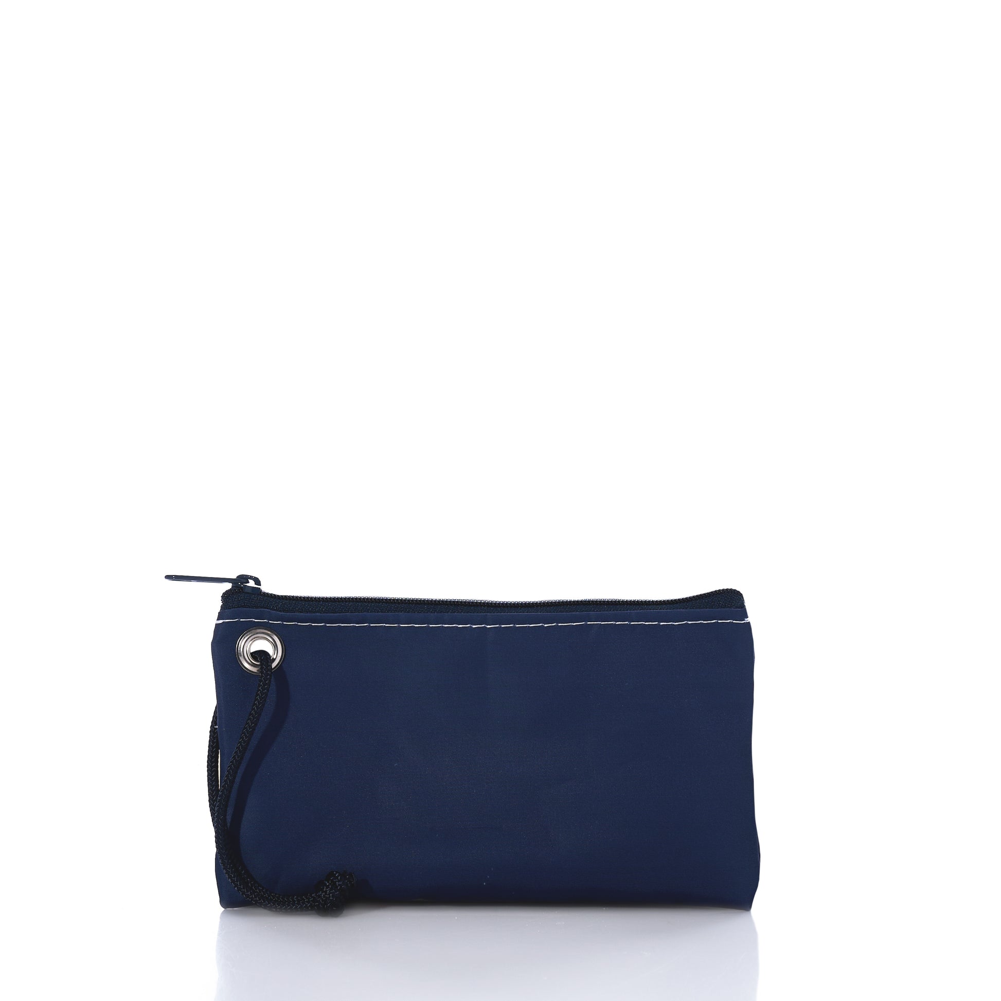 The Sea Bags 250th Patriotic Pine Wristlet is a small navy blue zippered pouch, crafted from recycled sailcloth with a black wrist strap and visible white stitching, shown against a plain white background—a classic Maine accessory with timeless coastal style. by Sea Bags