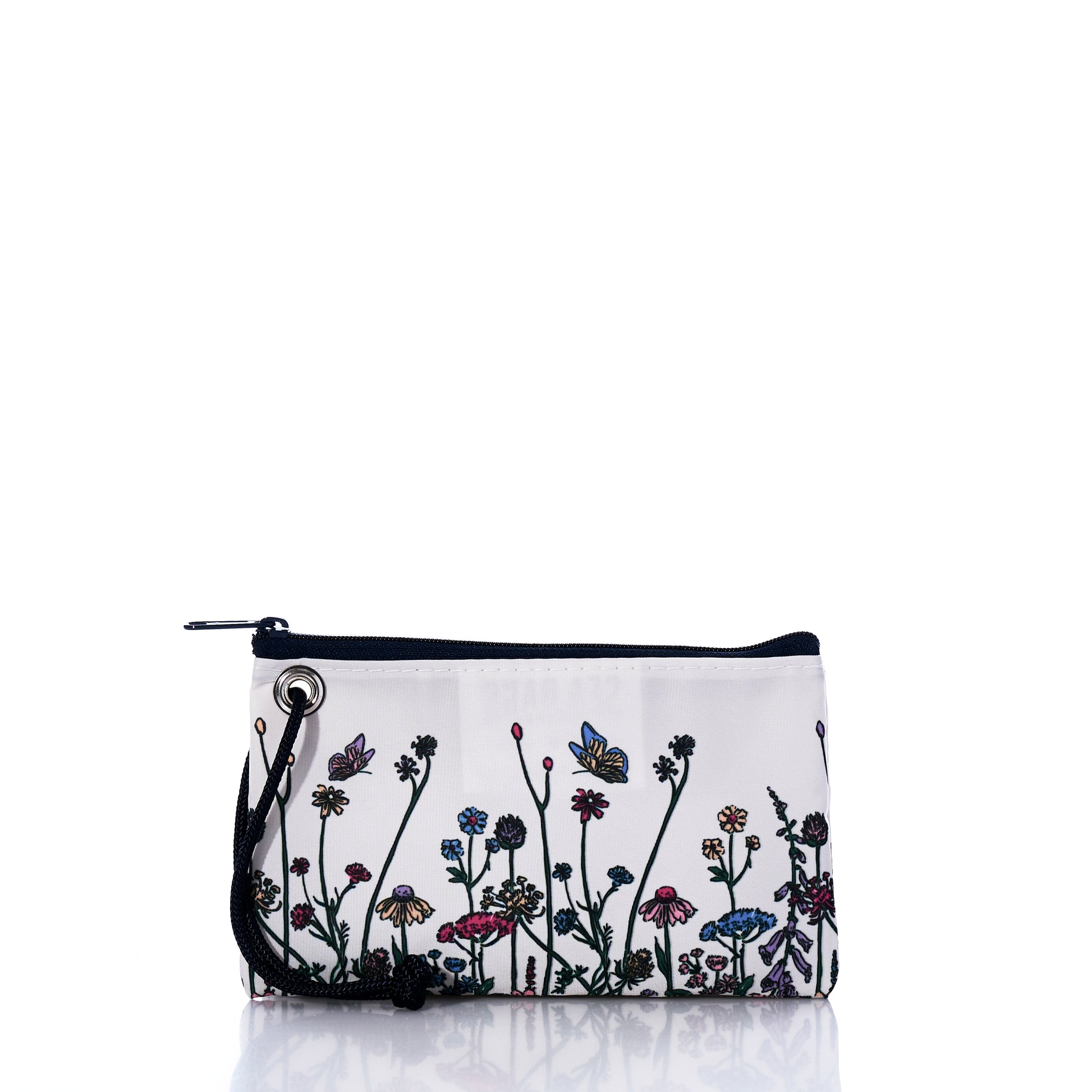 Introducing the Sea Bags Life is Good Wildflowers Wristlet—a rectangular white zippered pouch handcrafted in Maine from recycled sail material. This stylish accessory features a black strap and a vibrant floral and butterfly design on the front, combining sustainability with eye-catching charm. by Sea Bags