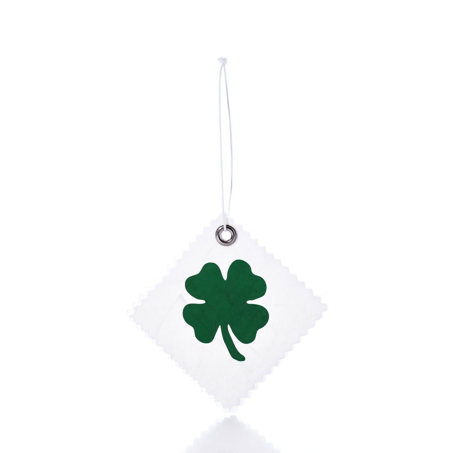 The Four Leaf Clover Sail Cloth Gift Tag by Sea Bags features a white square design crafted from sail cloth, adorned with a green four-leaf clover motif and suspended by a string against a white background—making it an eco-friendly and charming gift accessory or distinctive clover bag charm. by Sea Bags