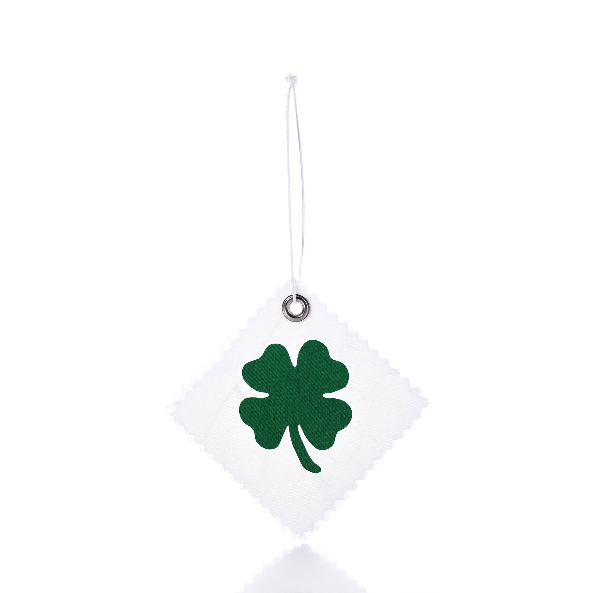 The Four Leaf Clover Sail Cloth Gift Tag by Sea Bags features a white square design crafted from sail cloth, adorned with a green four-leaf clover motif and suspended by a string against a white background—making it an eco-friendly and charming gift accessory or distinctive clover bag charm. by Sea Bags
