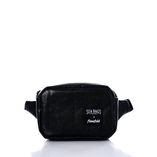 Introducing the Black Dragon Belt Bag from Sea Bags—a black, rectangular, water-resistant waist bag with a zippered main compartment and an adjustable strap. Featuring the Sea Bags logo on the front, this unique accessory is a stylish and practical gift for anyone on the go. by Sea Bags