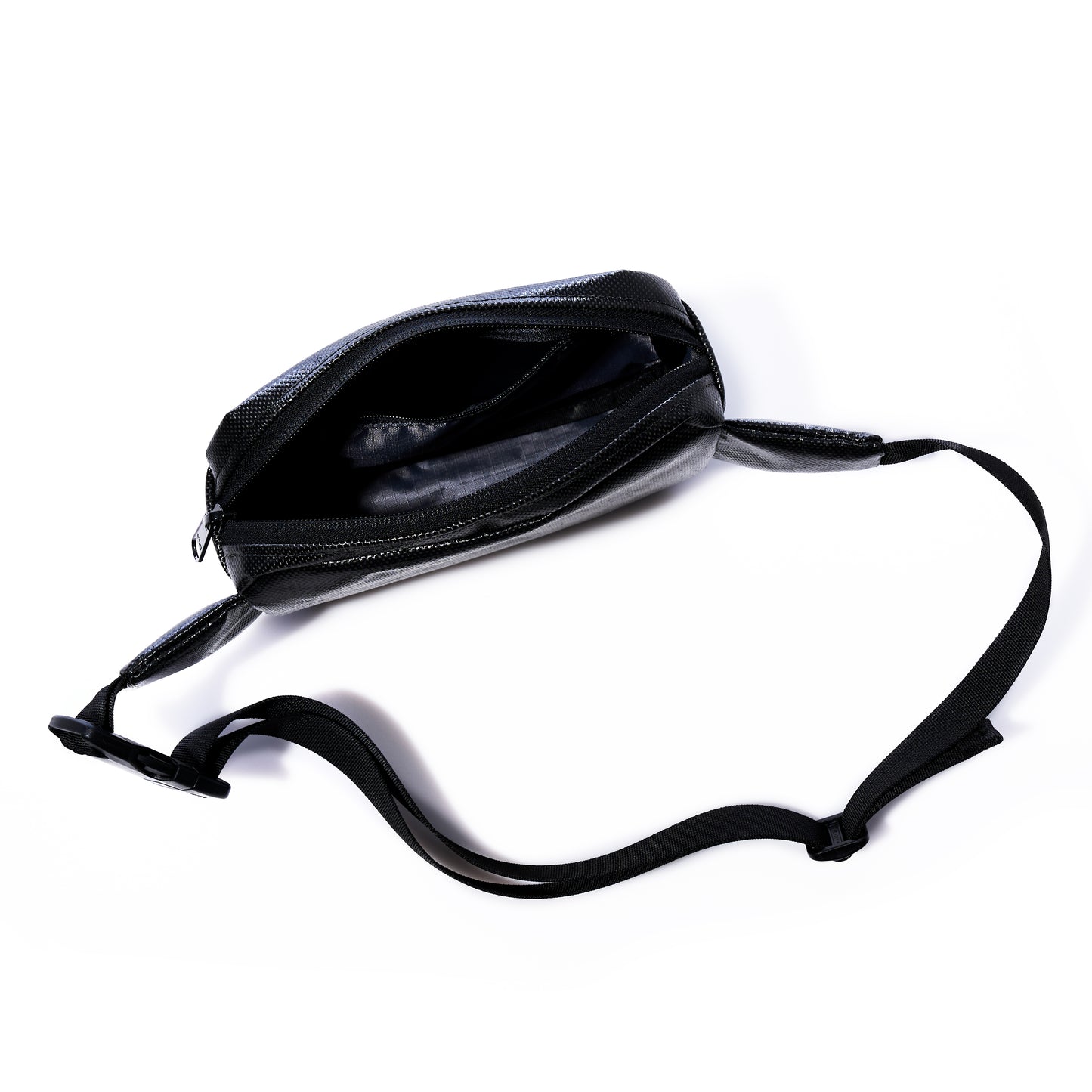 The Sea Bags Black Dragon Belt Bag is shown with its adjustable strap, unzipped to reveal the empty main compartment against a white background. Crafted from water-resistant material, this versatile crossbody bag makes a practical and unique gift for anyone on the go. by Sea Bags