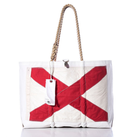 Sea Bags Victor Signal Flag Large Tote is crafted from recycled sail cloth and features a bold red X design inspired by maritime signal flags on the front, finished with sturdy rope handles and a crisp white hang tag. by Sea Bags