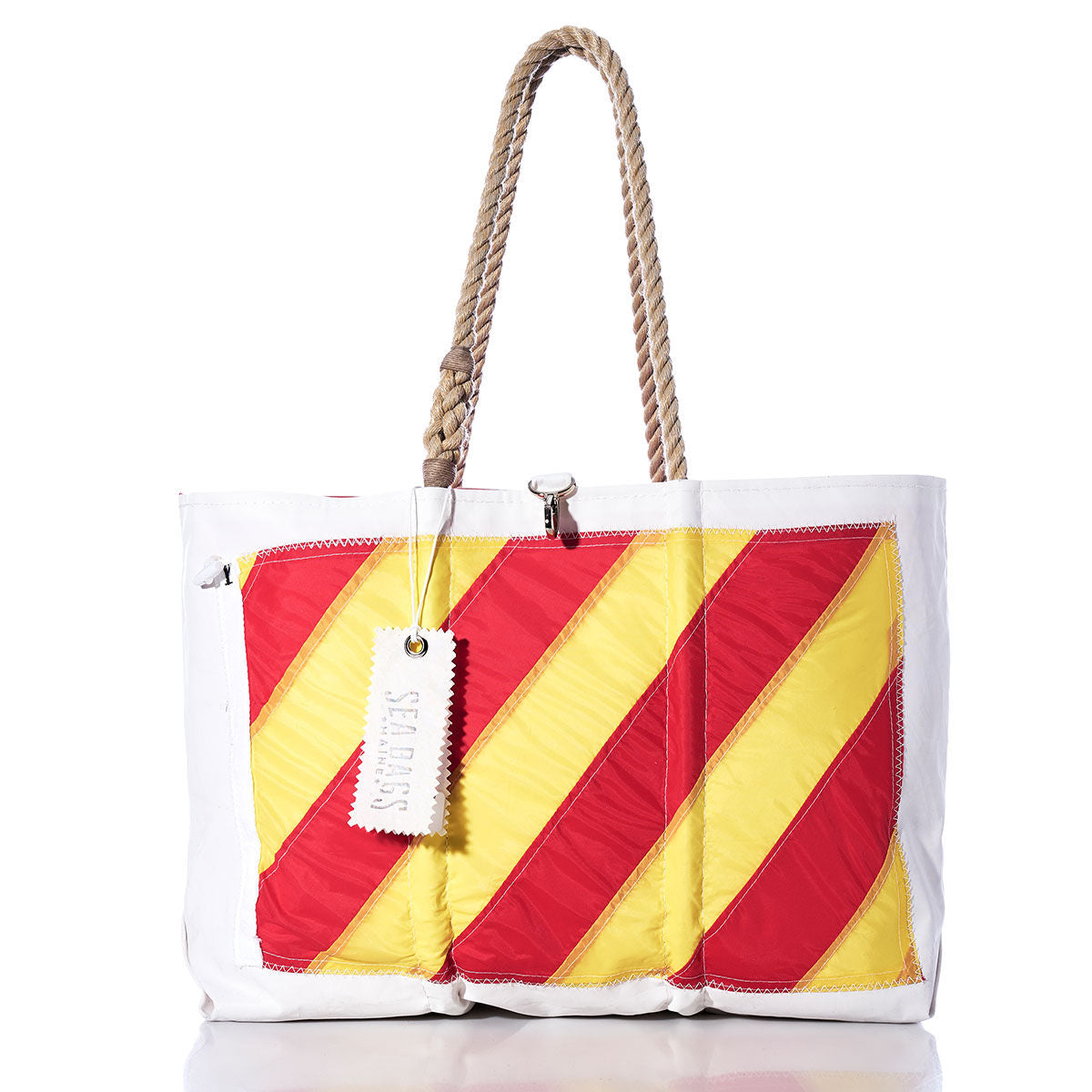 Sea Bags Yankee Signal Flag Large Tote, crafted from recycled sail cloth, features yellow and red diagonal stripes inspired by vintage signal flags, sturdy rope handles, and a white Sea Bags tag attached to the handle. by Sea Bags