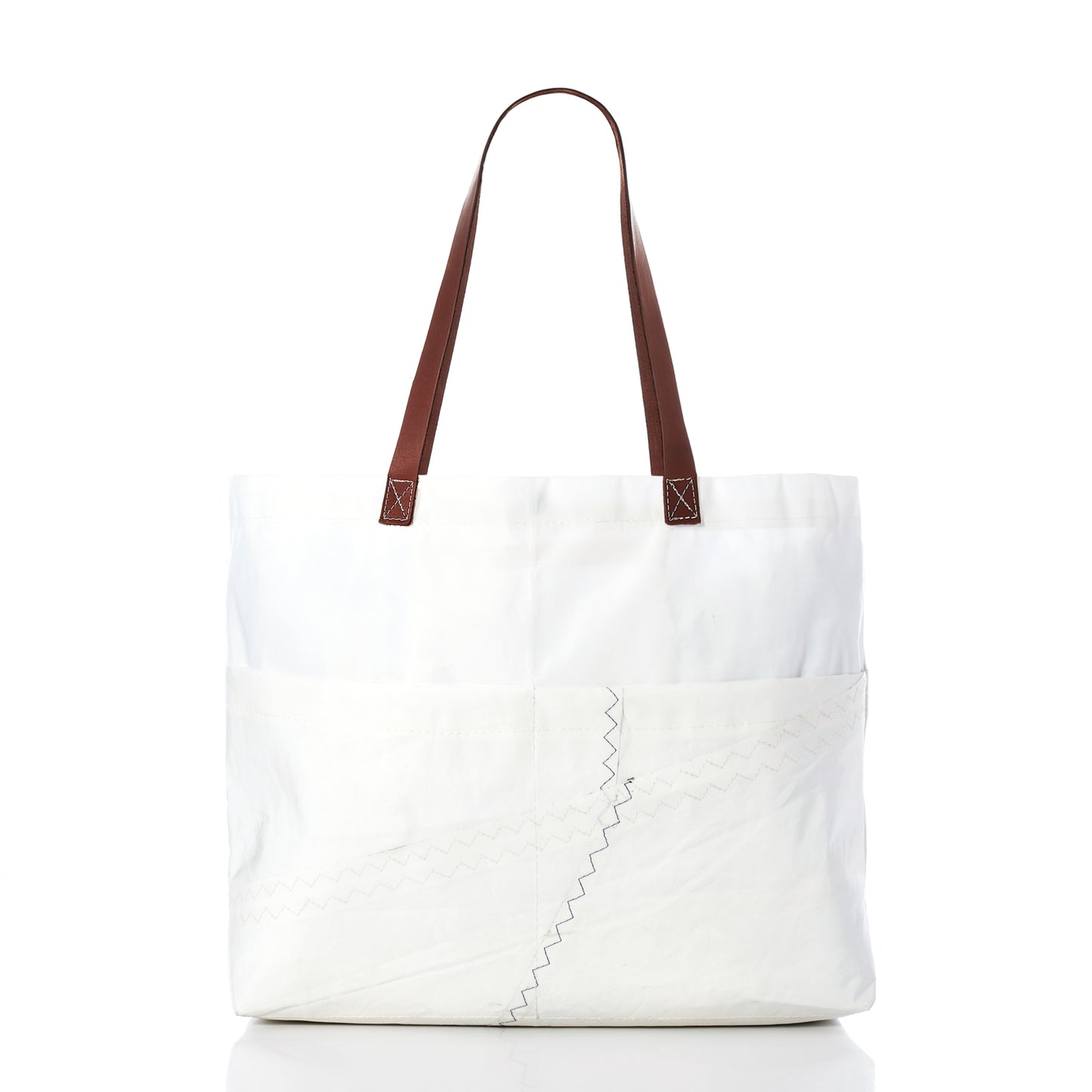 The Sea Bags Large Market Tote, crafted from white recycled sail with brown leather handles and prominent zigzag stitching, is displayed against a plain white background. by Sea Bags