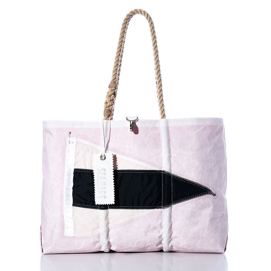 The Sea Bags 3rd Repeat Signal Flag Large Tote is crafted from pink and white recycled sail cloth, features sturdy rope handles, and is adorned with a bold black geometric design reminiscent of vintage signal flags. A white SEABAGS tag accents the tote, adding maritime charm to any outing. by Sea Bags