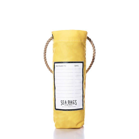 The Butter Wine Bag by Sea Bags is a yellow cylindrical wine bag with a rope handle, crafted from recycled sail cloth. It features a white label on the front that reads SEA BAGS MAINE, along with blank spaces for RECYCLED TO and DATE. The bag is photographed against a white background. by Sea Bags
