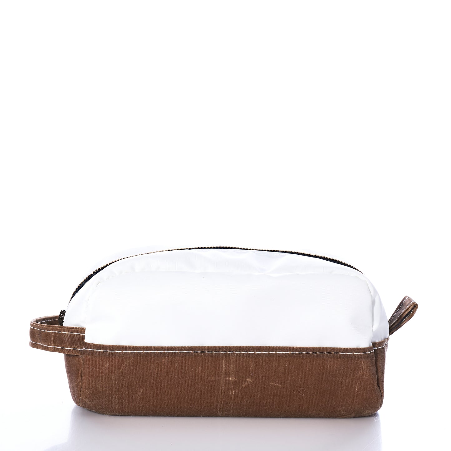 Introducing the Tan Chebeague Toiletry Bag by Sea Bags—a compact zippered pouch made from durable waxed canvas, featuring a white top, brown base, and convenient side handle, pictured against a plain white background. Ideal for those who appreciate seaworthy travel bags. by Sea Bags