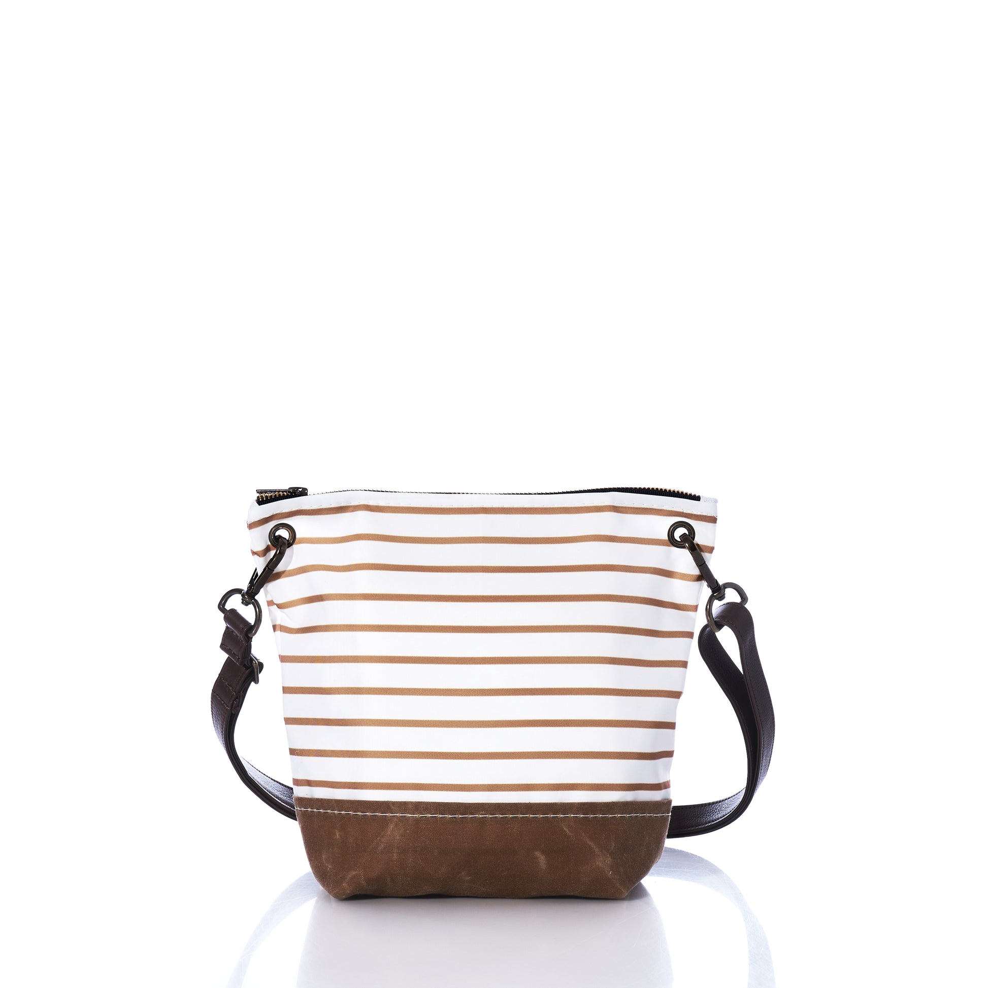 The Sea Bags Tan Chebeague Stripe Crossbody is a small tote bag crafted from recycled sailcloth, featuring brown and white horizontal stripes, a tan base, and a detachable black leather shoulder strap. The bag has a zippered top and is photographed against a white background. by Sea Bags