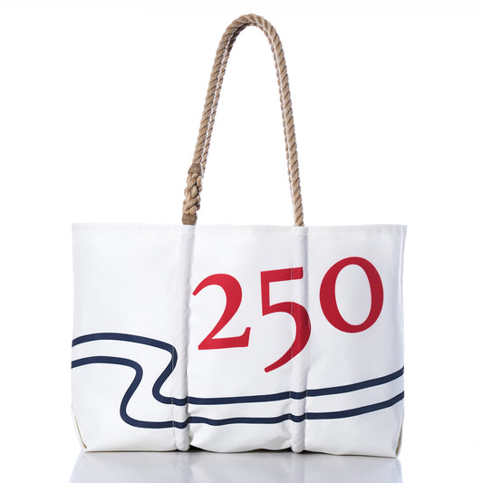 The Sea Bags 250th Patriotic Large Tote, handcrafted in Maine from recycled sail cloth, features rope handles, a bold blue wavy line, and a prominent red 250 on the front; shown photographed against a white background. by Sea Bags