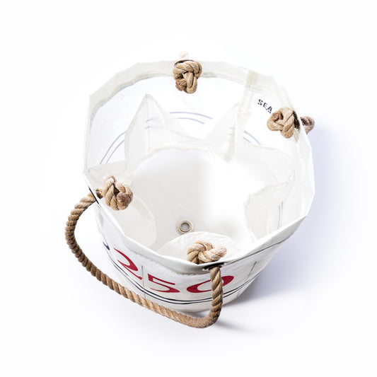 The 250th Patriotic Beverage Bucket Bag by Sea Bags is handcrafted in Maine from recycled sail cloth and features white canvas accented with a knotted rope handle, bold red 250 graphic, and a grommet at the base. The bag is photographed against a white background. by Sea Bags