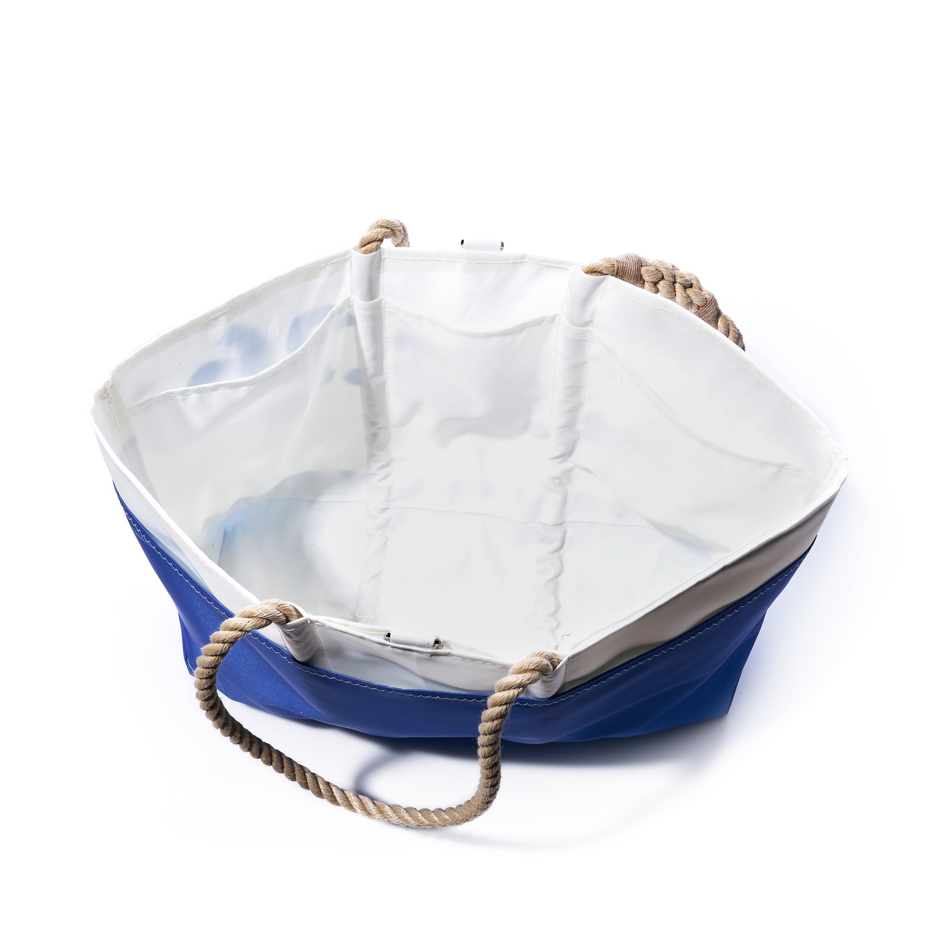 A Sea Bags Custom Date Ogunquit Beach Tote, crafted from recycled sailcloth in blue and white with rope handles, is photographed from above on a white background. The personalized tote bag is pictured empty and open. by Sea Bags