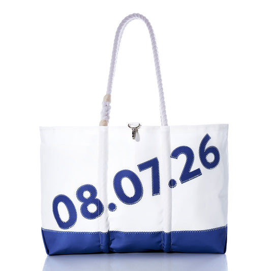 Crafted by Sea Bags from durable recycled sailcloth, the Custom Date Ogunquit Beach Tote features white and blue accents, sturdy rope handles, and the date 08.07.26 printed diagonally in blue on the front. Shown against a white background, this personalized tote is perfect for commemorating special memories at Ogunquit Beach. by Sea Bags