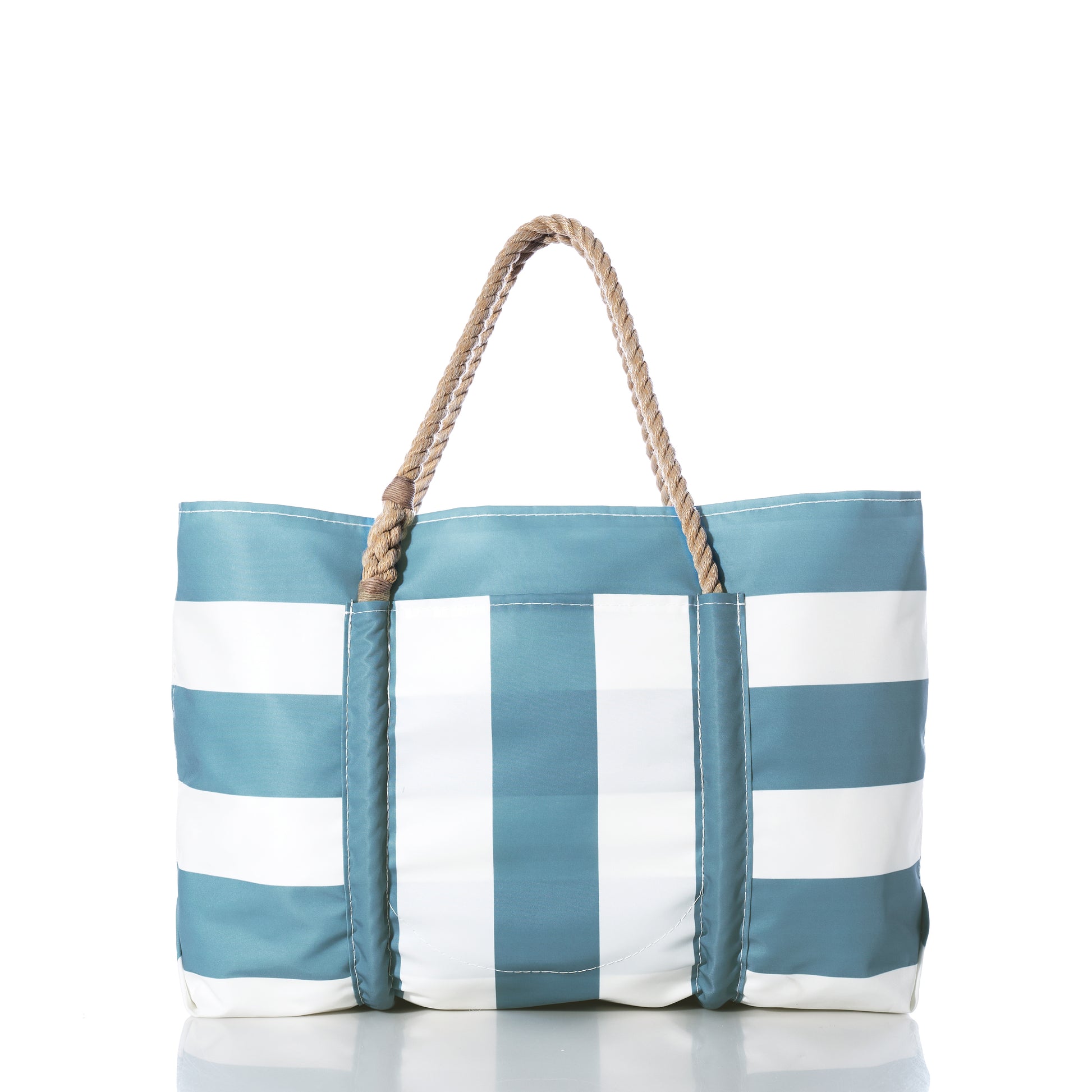 The Sea Bags Denim Blue Trolley Sleeve Travel Pier Tote features blue and white stripes, tan rope handles, and a convenient trolley sleeve, shown against a white background. by Sea Bags