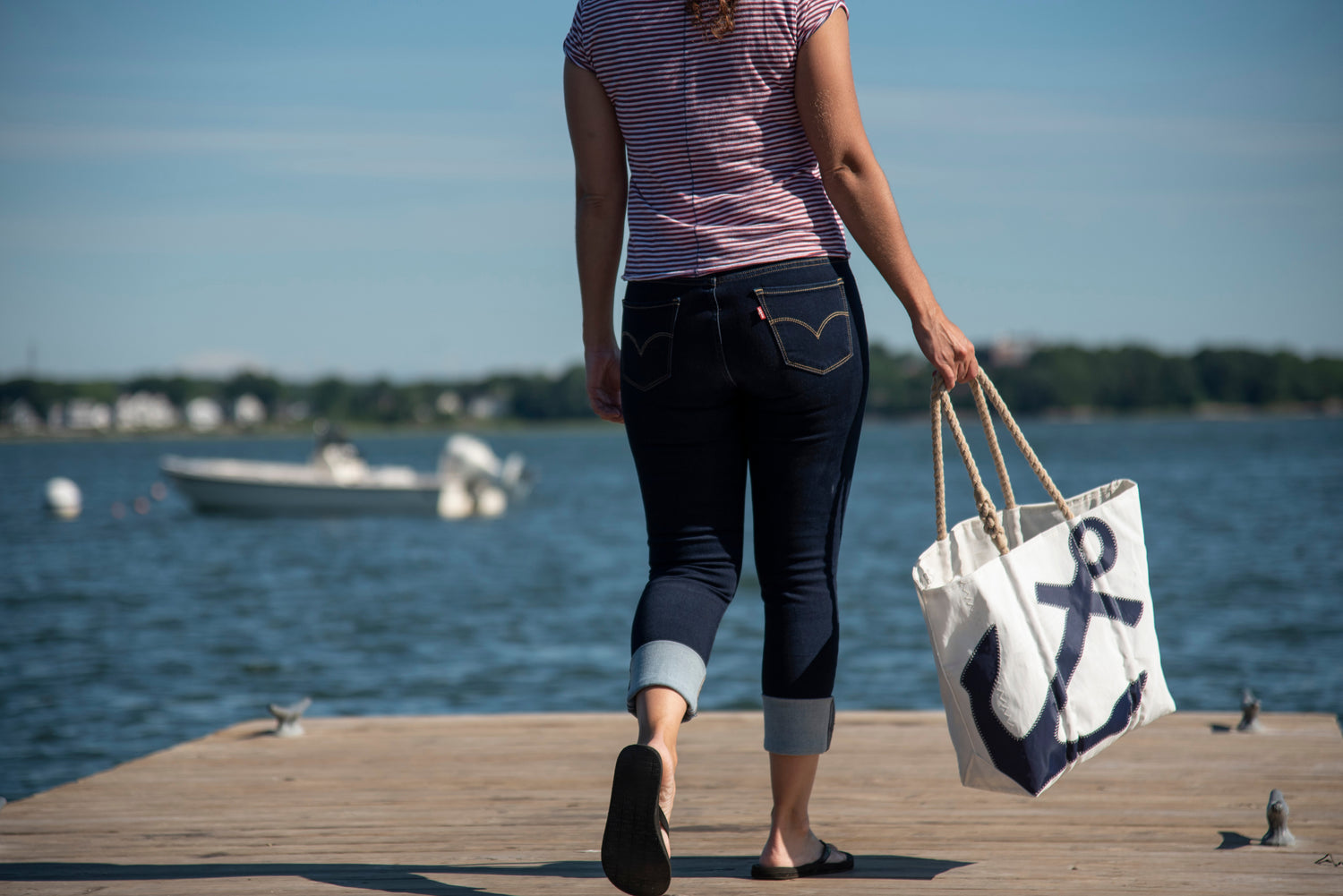 recycled sail cloth navy anchor tote with rope handles on boat dock in harbor with nautical style