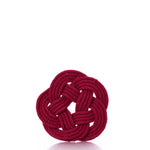 A set of four Nautical Sailor Knot Coasters by true features red rope intricately tied into decorative, interwoven circular patterns, set against a white background—ideal as handmade cotton coasters for a distinctive touch.