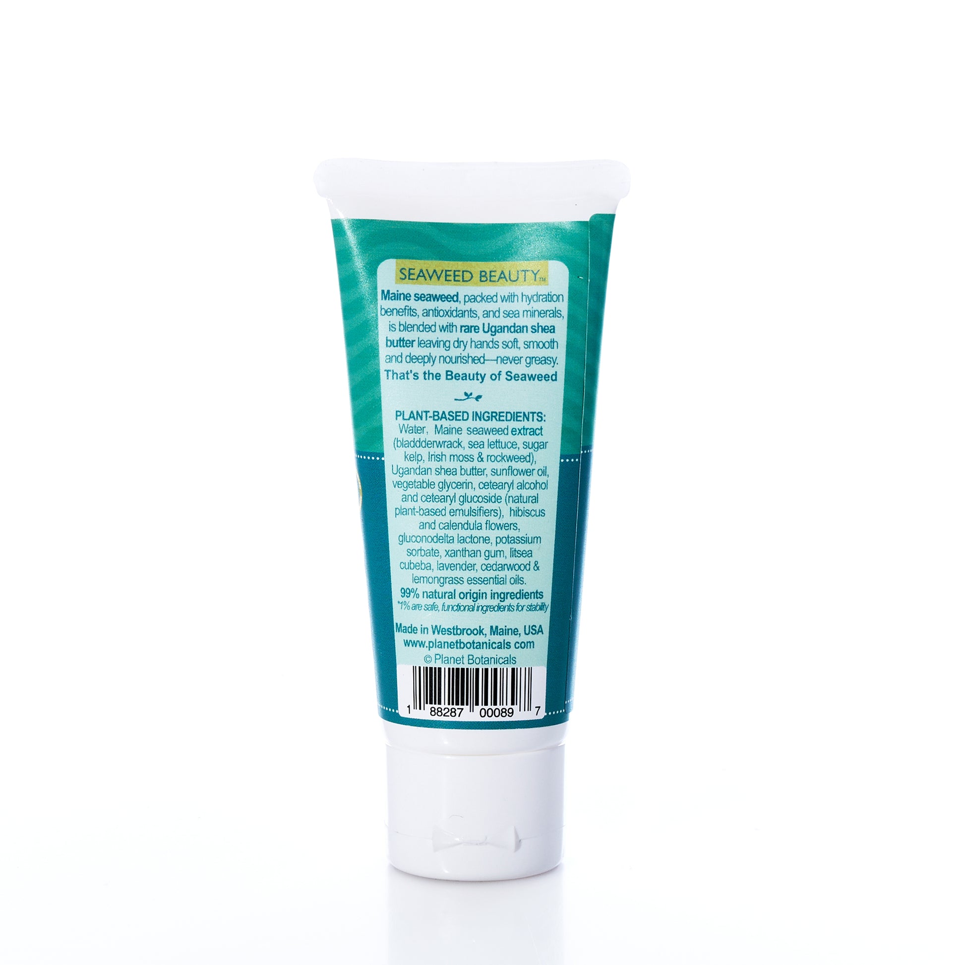 A 2 oz tube of Planet Botanicals Seaweed Hand Cream, labeled with ingredient and company information and featuring a green and blue coastal-inspired design, stands upright on a white background.