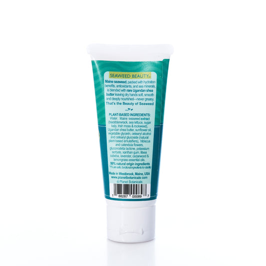 A 2 oz tube of Planet Botanicals Seaweed Hand Cream, labeled with ingredient and company information and featuring a green and blue coastal-inspired design, stands upright on a white background.