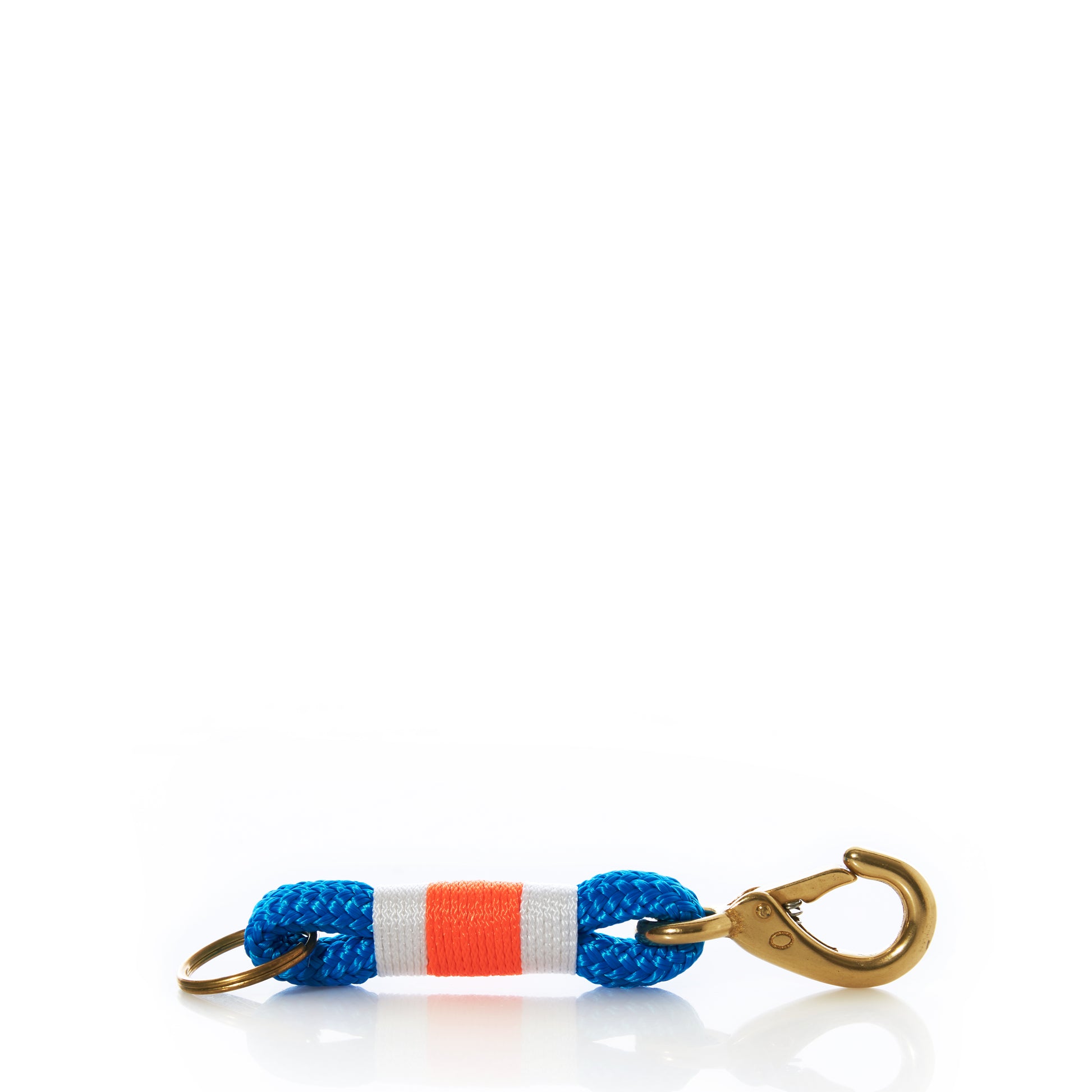 Fishermans Rope Keychain-Blue/Orange by Custom Cordage / DBA Maine Rope Mats, handmade in Maine and inspired by classic nautical keychains, features blue yacht braid rope with a white and orange center stripe, a gold key ring on one end, and a gold clasp on the other, shown against a white background. by Sea Bags